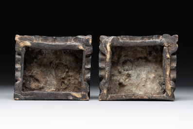A pair of Chinese bronze guardians on stands, 17/18th C.