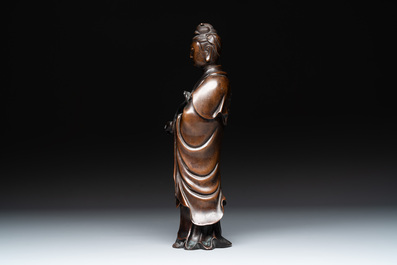 A Chinese bronze Guanyin holding a ruyi, 17/18th C.