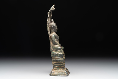 A Khmer bronze figure of Buddha Mucilinda, Angkor period, 12/13th C.