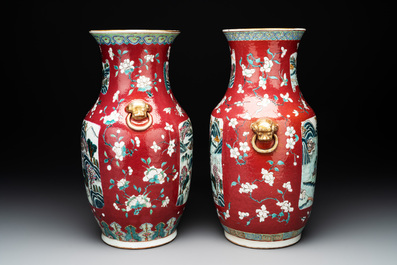 A pair of Chinese famille rose ruby-ground 'landscape' vases, 19th C.