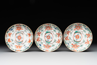 A set of 12 Chinese famille verte cups and saucers with floral design, Kangxi