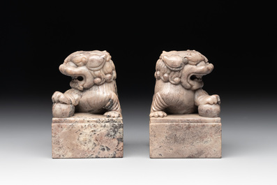 A pair of Chinese grey marble 'lion' seals and a seal, 20th C.