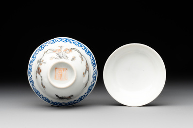 A Chinese gilt-decorated iron-red teapot and a blue-enamelled grisaille covered cup, 18/19th C.