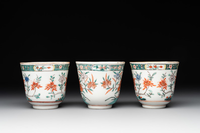 A set of 12 Chinese famille verte cups and saucers with floral design, Kangxi
