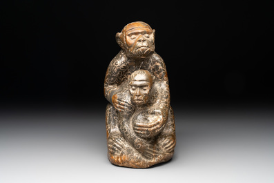 A Chinese stone group of two monkeys, 20th C.