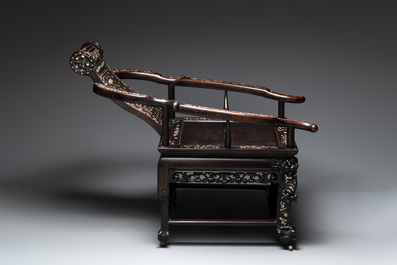 A Chinese mother-of-pearl-inlaid hongmu reclining armchair and retractable footrest, Canton, 19th C.