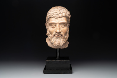 A large terracotta head of a bearded man, Gandhara region, Kushan period, 4/5th C.