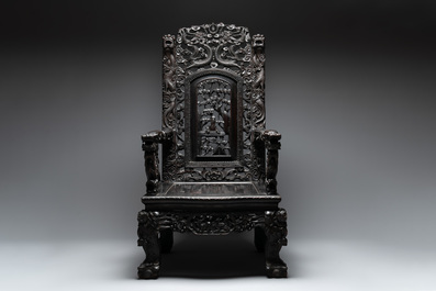 A Chinese richly carved and lacquered hongmu armchair, Canton, 19th C.