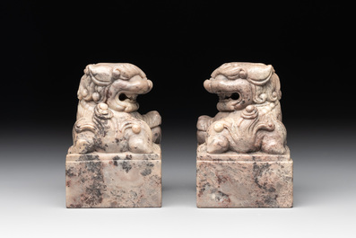 A pair of Chinese grey marble 'lion' seals and a seal, 20th C.