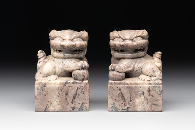 A pair of Chinese grey marble 'lion' seals and a seal, 20th C.
