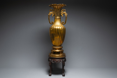 A massive Japanese metal alloy vase on a Chinese hardwood stand with marble top, Kyoto mark, Showa, 20th C.