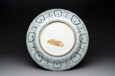 A large Chinese blue and white 'kraak' dish with birds among flowering branches, Wanli