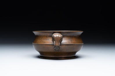 A Chinese bronze elephant-head-handled censer, Wan Shou Wu Jiang 萬壽無疆 mark, 19th C.