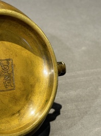 A Chinese bronze elephant-head-handled censer, Wan Shou Wu Jiang 萬壽無疆 mark, 19th C.