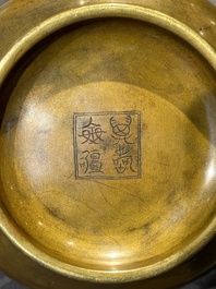 A Chinese bronze elephant-head-handled censer, Wan Shou Wu Jiang 萬壽無疆 mark, 19th C.
