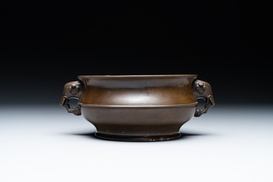 A Chinese bronze elephant-head-handled censer, Wan Shou Wu Jiang 萬壽無疆 mark, 19th C.