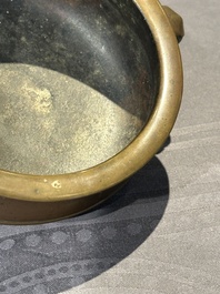 A Chinese bronze elephant-head-handled censer, Wan Shou Wu Jiang 萬壽無疆 mark, 19th C.