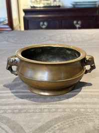 A Chinese bronze elephant-head-handled censer, Wan Shou Wu Jiang 萬壽無疆 mark, 19th C.