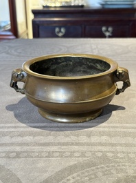 A Chinese bronze elephant-head-handled censer, Wan Shou Wu Jiang 萬壽無疆 mark, 19th C.