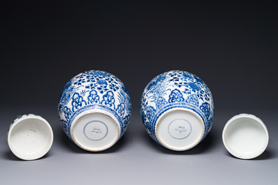 A pair of Chinese blue and white ginger jars and covers with floral design, Kangxi