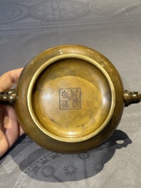 A Chinese bronze elephant-head-handled censer, Wan Shou Wu Jiang 萬壽無疆 mark, 19th C.