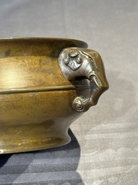 A Chinese bronze elephant-head-handled censer, Wan Shou Wu Jiang 萬壽無疆 mark, 19th C.