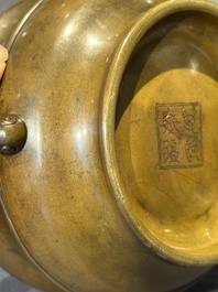 A Chinese bronze elephant-head-handled censer, Wan Shou Wu Jiang 萬壽無疆 mark, 19th C.
