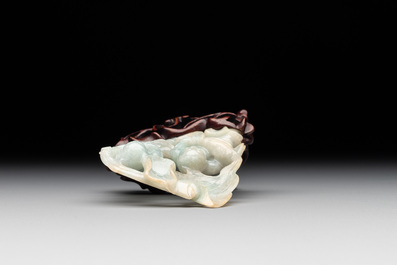 A Chinese jade 'He He Er Xian' group on wooden stand, 19th C.