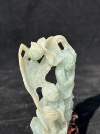 A Chinese jade 'He He Er Xian' group on wooden stand, 19th C.