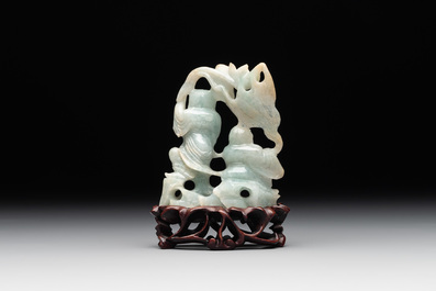 A Chinese jade 'He He Er Xian' group on wooden stand, 19th C.