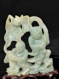 A Chinese jade 'He He Er Xian' group on wooden stand, 19th C.