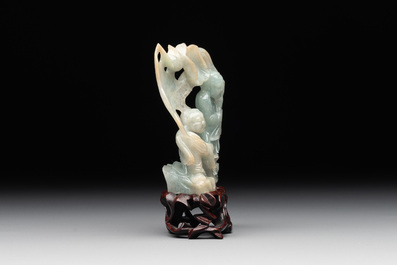A Chinese jade 'He He Er Xian' group on wooden stand, 19th C.