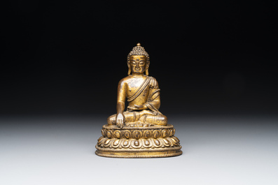 A fine Sino-Tibetan gilt bronze Buddha, 15/16th C.