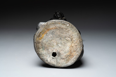 A lead sculpture of a lady pouring water, 19th C.