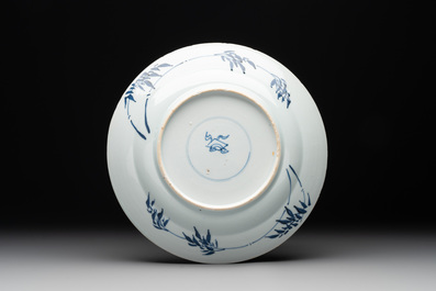 A Chinese blue and white 'Master of the Rocks' plate, Kangxi