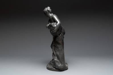 A lead sculpture of a lady pouring water, 19th C.