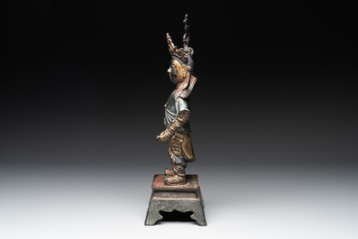 A Chinese gilt-lacquered bronze guardian, Ming