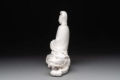 A Chinese Dehua blanc de Chine Guanyin seated on a Buddhist lion, 20th C.