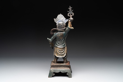 A Chinese gilt-lacquered bronze guardian, Ming