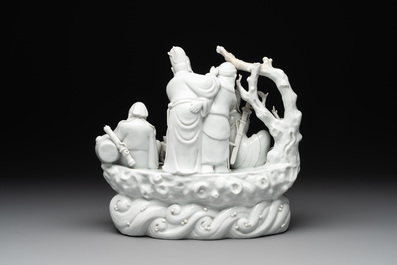 A Chinese Dehua blanc de Chine group of four deities on a boat, Republic