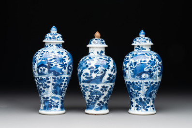 A Chinese blue and white garniture with five vases, Kangxi