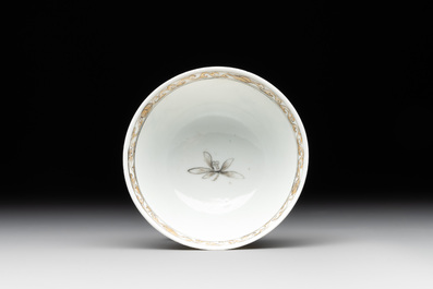 A Chinese blue-enamelled gilt-decorated grisaille cup and saucer, Yongzheng