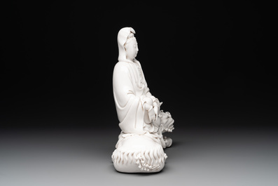 A Chinese Dehua blanc de Chine Guanyin seated on a Buddhist lion, 20th C.