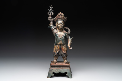 A Chinese gilt-lacquered bronze guardian, Ming