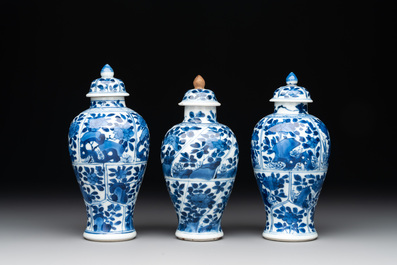 A Chinese blue and white garniture with five vases, Kangxi
