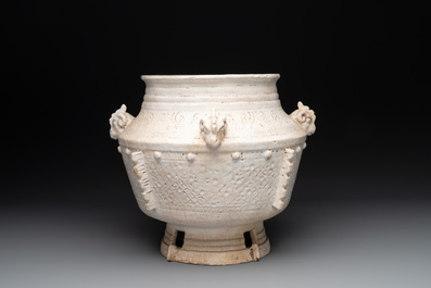 A Chinese archaistic white-glazed vase on wooden stand, Qing