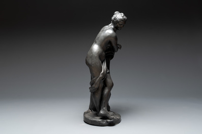A lead sculpture of a lady pouring water, 19th C.