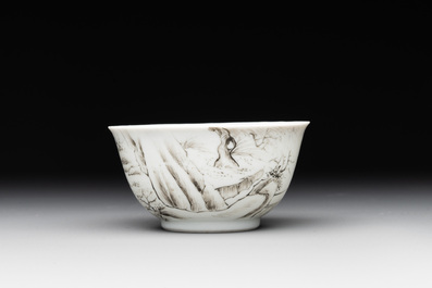 A Chinese blue-enamelled gilt-decorated grisaille cup and saucer, Yongzheng