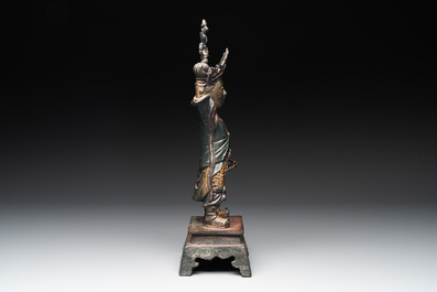 A Chinese gilt-lacquered bronze guardian, Ming