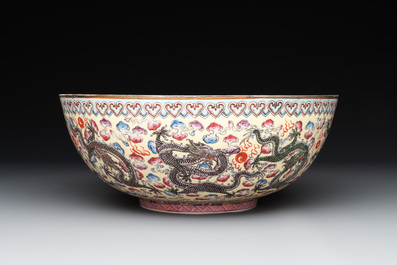 Two Chinese eggshell famille rose 'dragon' bowls on wooden stands, Qianlong mark, 20th C.
